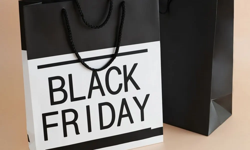 Black and white shopping bags printed with the words Black Friday
